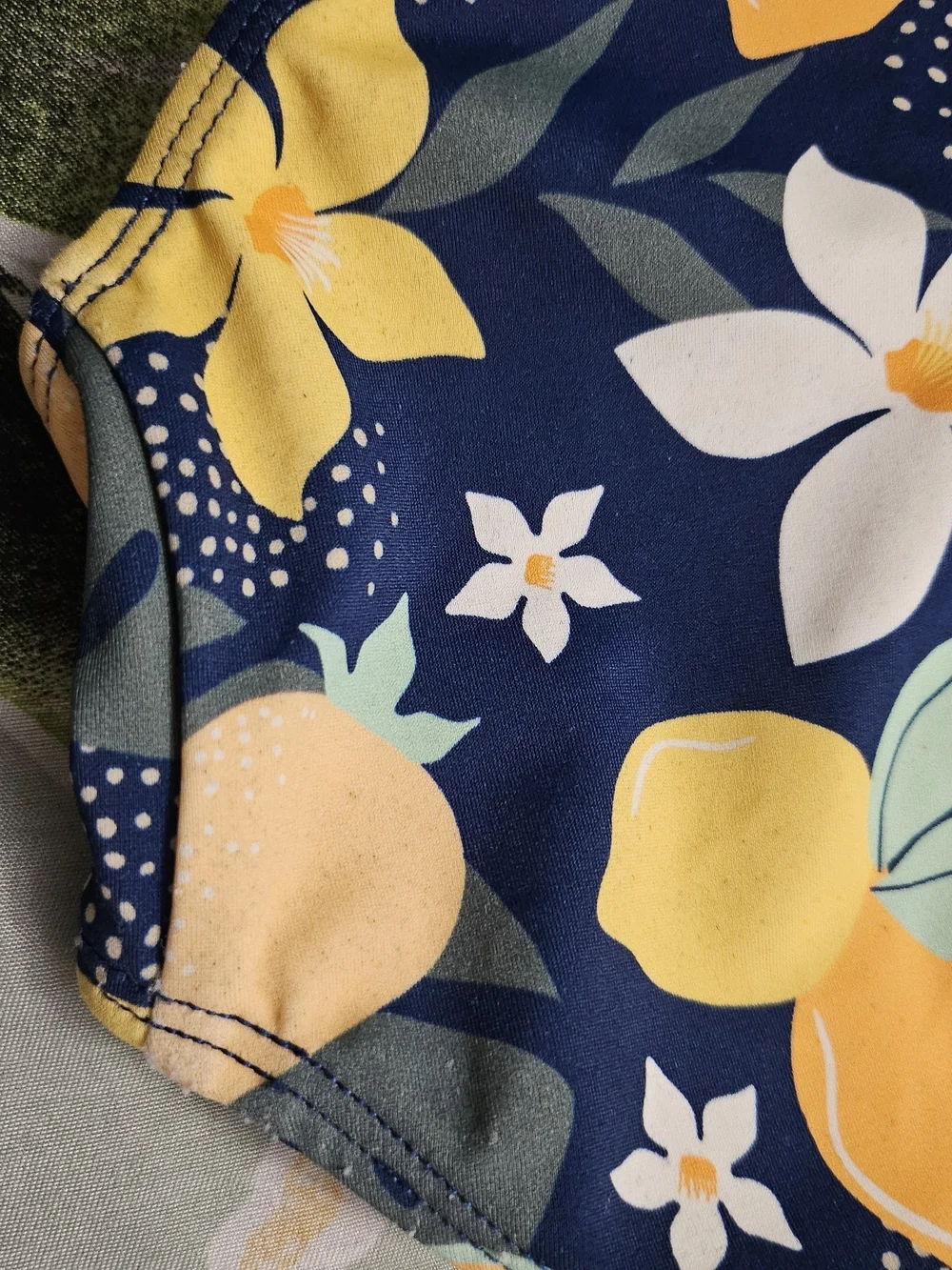 Ruffle Butts Navy One-Piece Swimsuit with Yellow Fruit Print